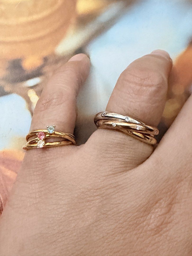 Cute Japan rings.💍 (Category: Rings) located in Pasig City. Submitted by smartshopping.ph (Listing ID 1466076408, Image 3). Description: Cute rings.💍 Top Left Ring: A bow with brilliant oval-cut pink rhinestone at its center. Size 6 350 php • Bottom Left Ring: A modern multi-layer gold stackable ring set joined dynamically with tiny charm hooks, detailed with miniature prong-set crystal settings. Size 6.5. 500 php • Right Interlocking Bands: A 