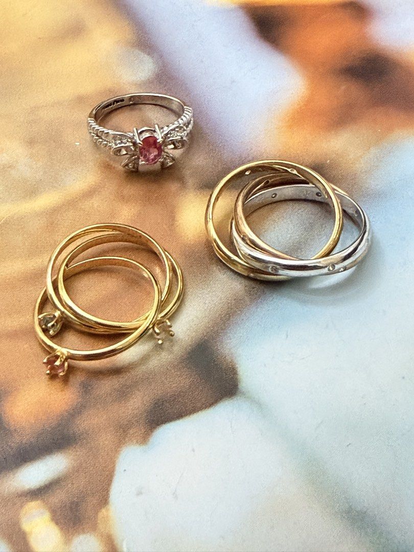 Cute Japan rings.💍 (Category: Rings) located in Pasig City. Submitted by smartshopping.ph (Listing ID 1466076408, Image 1). Description: Cute rings.💍 Top Left Ring: A bow with brilliant oval-cut pink rhinestone at its center. Size 6 350 php • Bottom Left Ring: A modern multi-layer gold stackable ring set joined dynamically with tiny charm hooks, detailed with miniature prong-set crystal settings. Size 6.5. 500 php • Right Interlocking Bands: A 