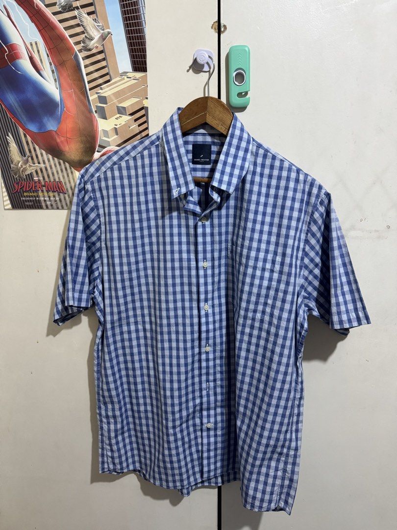 Daniel Hechter Paris Blue Gingham Button-Down Shirt (Category: Tshirts & Polo Shirts ) located in Taguig. Submitted by declutteringbyalexis (Listing ID 1466027566, Image 1). Description: - Brand: Daniel Hechter Paris - Style: Short-sleeve button-down shirt - Pattern: Classic blue and white checkered - Features: Standard collar, front button closure, one left chest pocket - Quality: Clean stitching and premium fabric - Ideal for: Casual daily wear