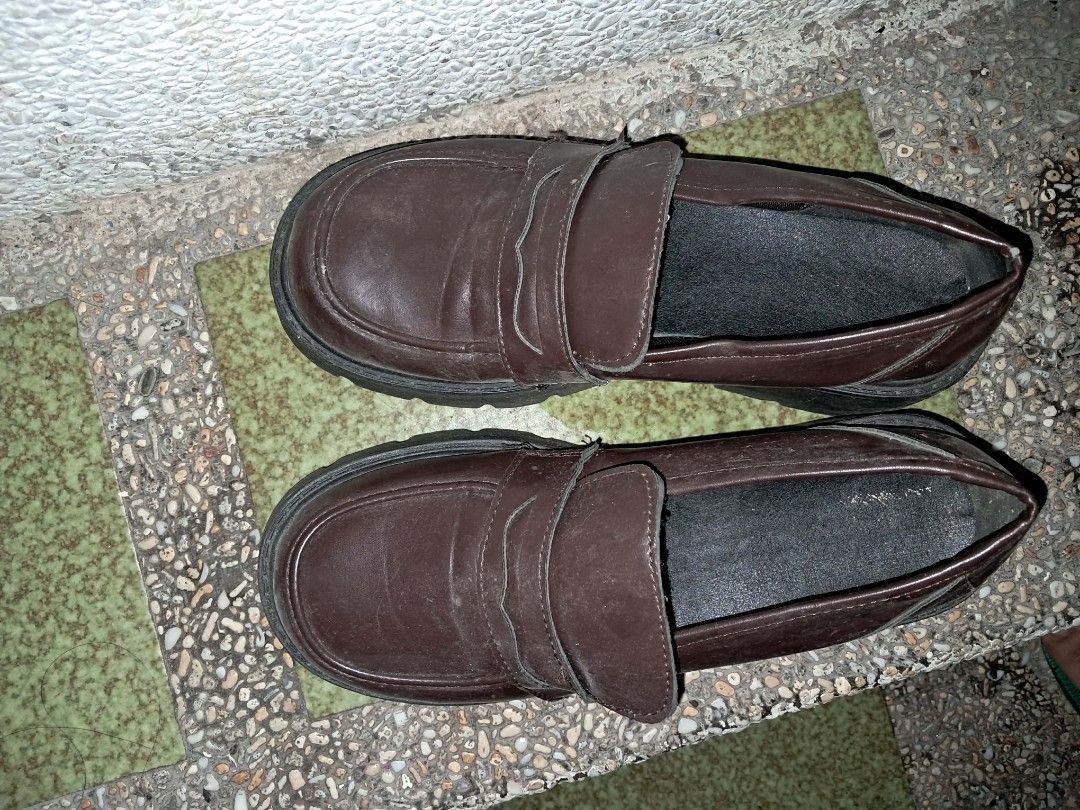 Dark brown chunky platform loafers size 40 (Category: Loafers) located in Makati City. Submitted by j.angelxa (Listing ID 1465968394, Image 1). Description: - Dark brown chunky loafers with a stylish slip-on design and penny strap - Size: 41 (marked on the bottom sole) - Features thick lug soles for extra height and a trendy look - Material: Leather-look finish with light creasing on top from normal wear - Outsoles: Sturdy rubber with plenty of g