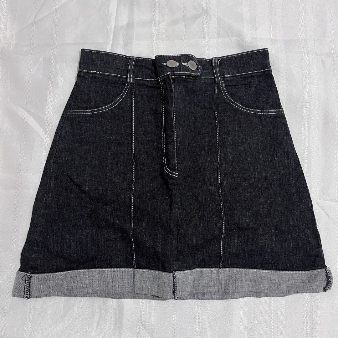Dark Denim Skirt with Rolled Hem (Category: Skirts) located in Baguio. Submitted by gbwardrobe (Listing ID 1466022073, Image 1). Description: - Dark denim mini skirt with trendy contrast white stitching - High-waisted fit with a secure double metal button closure - Features two functional front pockets - Relaxed rolled cuff hem for a casual vibe - Sturdy fabric with vertical panel seams for a flattering silhouette.