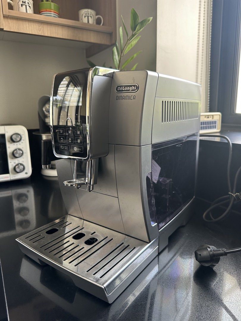 DeLonghi Dinamica Espresso Machine (Category: Coffee Machines & Makers) located in San Juan City. Submitted by mightycrystal_4094bb (Listing ID 1466093074, Image 2). Description: - Model: DeLonghi Dinamica Automatic Coffee Machine - Color: Elegant Silver - Features built-in grinder with an adjustable top dial - User-friendly digital control panel with direct-select buttons - Equipped with a side steam wand for milk frothing - Easy-access water ta