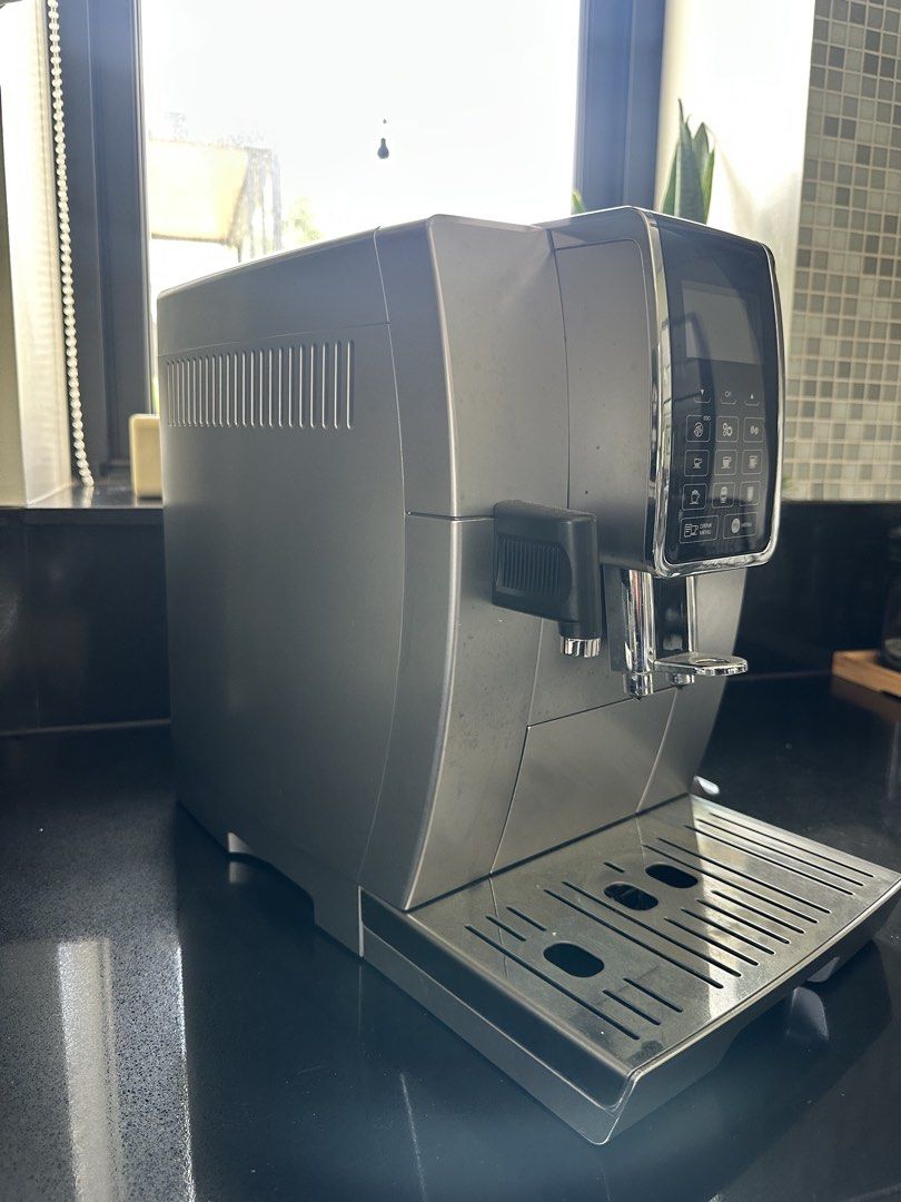 DeLonghi Dinamica Espresso Machine (Category: Coffee Machines & Makers) located in San Juan City. Submitted by mightycrystal_4094bb (Listing ID 1466093074, Image 3). Description: - Model: DeLonghi Dinamica Automatic Coffee Machine - Color: Elegant Silver - Features built-in grinder with an adjustable top dial - User-friendly digital control panel with direct-select buttons - Equipped with a side steam wand for milk frothing - Easy-access water ta