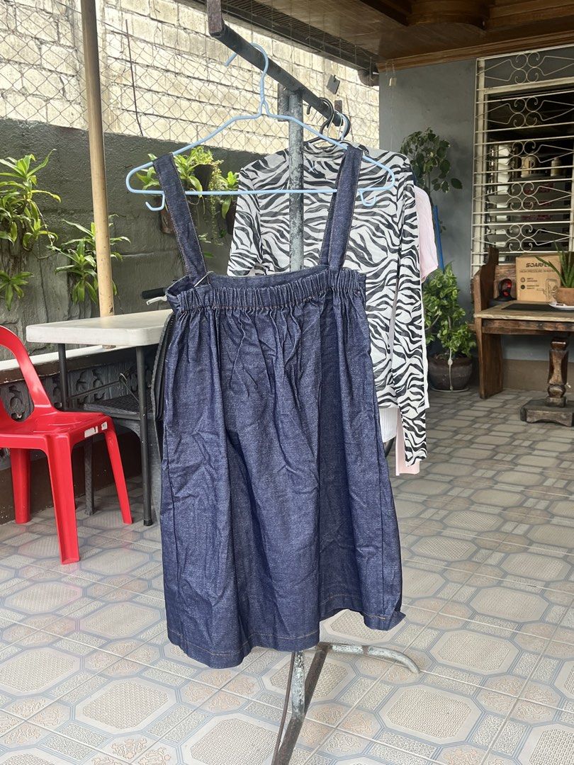 Denim Pinafore Dress (Category: Dresses) located in Dinalupihan. Submitted by penaflorcj (Listing ID 1466011925, Image 2). Description: - Color: Dark blue denim - Design: Square neckline, thick shoulder straps, and pleated front - Comfort: Smocked elastic back waist for a great fit - Style: Easy to layer with any top or dress over pants.
