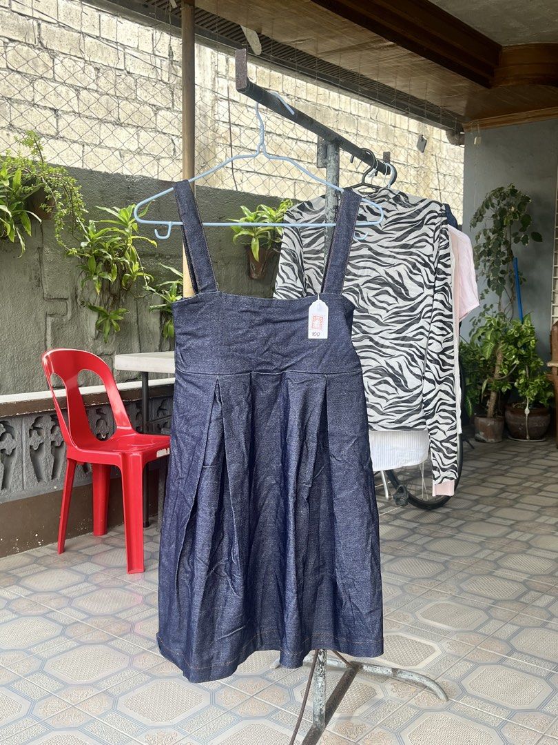 Denim Pinafore Dress (Category: Dresses) located in Dinalupihan. Submitted by penaflorcj (Listing ID 1466011925, Image 1). Description: - Color: Dark blue denim - Design: Square neckline, thick shoulder straps, and pleated front - Comfort: Smocked elastic back waist for a great fit - Style: Easy to layer with any top or dress over pants.