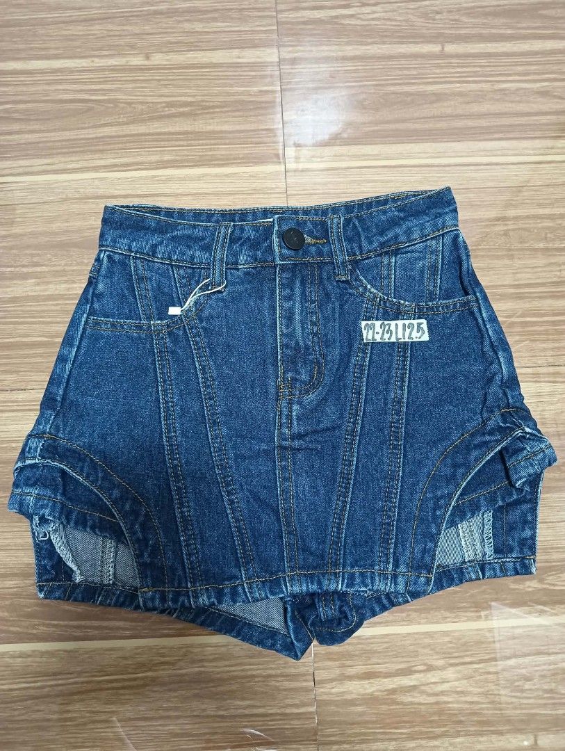 Denim Skort Shorts with Paneled Design (Category: Shorts) located in Manila. Submitted by ac_dl (Listing ID 1466112147, Image 1). Description: - Style: Unique denim skort with paneled seam details on front and back - Fit: High-waisted with belt loops and a single black front button - Color/Wash: Deep blue wash - Design: Short cut with trendy curved hem overlays - Size: Tag reads 22-23 L12.5 Handpicked skort, never nasuot Size: 22-23 Mode of Payme