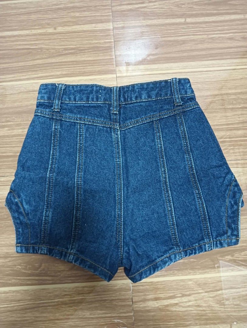 Denim Skort Shorts with Paneled Design (Category: Shorts) located in Manila. Submitted by ac_dl (Listing ID 1466112147, Image 2). Description: - Style: Unique denim skort with paneled seam details on front and back - Fit: High-waisted with belt loops and a single black front button - Color/Wash: Deep blue wash - Design: Short cut with trendy curved hem overlays - Size: Tag reads 22-23 L12.5 Handpicked skort, never nasuot Size: 22-23 Mode of Payme