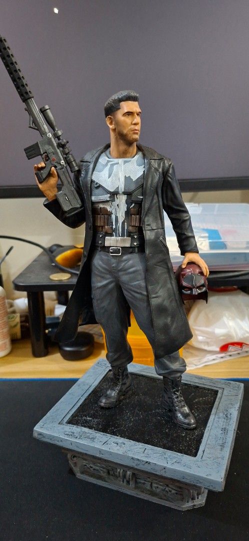 Diamond select gallery punisher TV 1/8 statue (Category: Figurines & Statues) located in Manila. Submitted by alfie44703 (Listing ID 1466094975, Image 1). Description: - Punisher collectible statue with textured square base - Detailed face sculpt and realistic weathered paint finish - Wears a long black trench coat over tactical gear - Holding a heavy sniper rifle in the right hand and a helmet in the left - Perfect display piece for Marvel and P