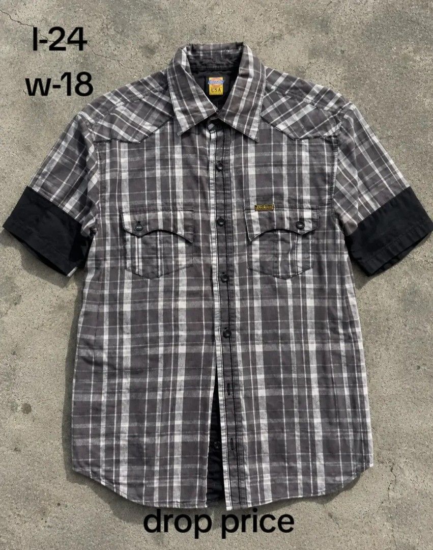 Dickies Short Sleeve Plaid Button-Down Shirt Gray (Category: Tshirts & Polo Shirts ) located in Manila. Submitted by gentletree_2294f3 (Listing ID 1466054504, Image 1). Description: - Brand: Dickies - Style: Short-sleeve button-down, casual workwear - Pattern/Color: Gray and white plaid with solid black sleeve cuffs - Details: Standard collar, front button placket, two chest pockets with flap closures - Measurements: Length 24", Width 18" - Condi