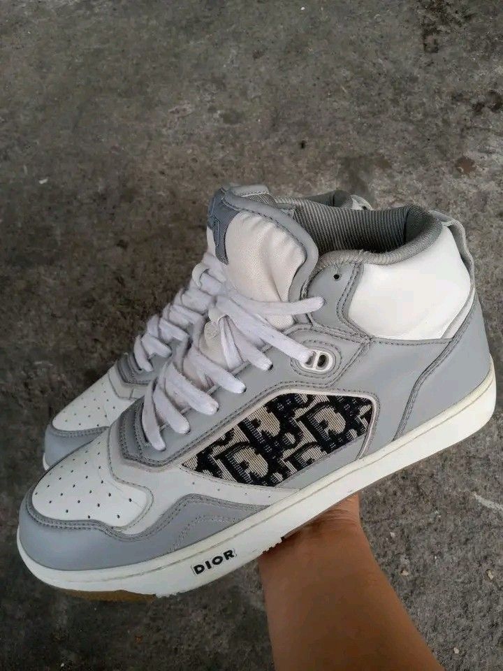 Dior White Gray canvas leather midcut sneakers (Category: Sneakers) located in Koronadal. Submitted by joeannmahi28609 (Listing ID 1466036758, Image 2). Description: dior white midcut sneakers made in Italy size eur 42 For men only coded in goods condition ukay source sino bet nito Dior gnda mga boss.