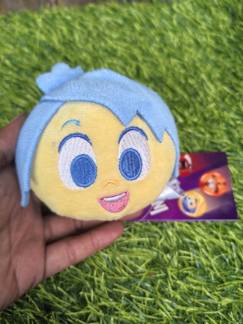 Disney Pixar Inside Out Sadness Plush Toy Charm (Category: Plushies & Soft Toys) located in Paranaque City. Submitted by furugiyafinds (Listing ID 1466033428, Image 1). Description: - Authentic Disney Pixar Inside Out Sadness character plush - Adorable round plushie style with embroidered facial details - Features bright blue hair and soft yellow sweater - Complete with original movie tag and Disney copyright label - Made with super soft, huggabl