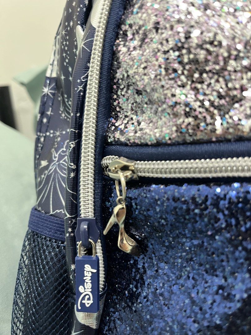 Disney Smiggle Cinderella Princess Backpack (Category: Backpacks) located in Taguig. Submitted by m.listings (Listing ID 1466155436, Image 3). Description: Auth and Brandnew, padala from abroad Unused with Plastic Bag from Smiggle With tags Still nego for sure buyer Disney and Smiggle Cinderella backpack in deep navy blue. Silver glitter pocket on front with a textured Cinderella graphic and tulle dress detail. All-over celestial print with Cinde