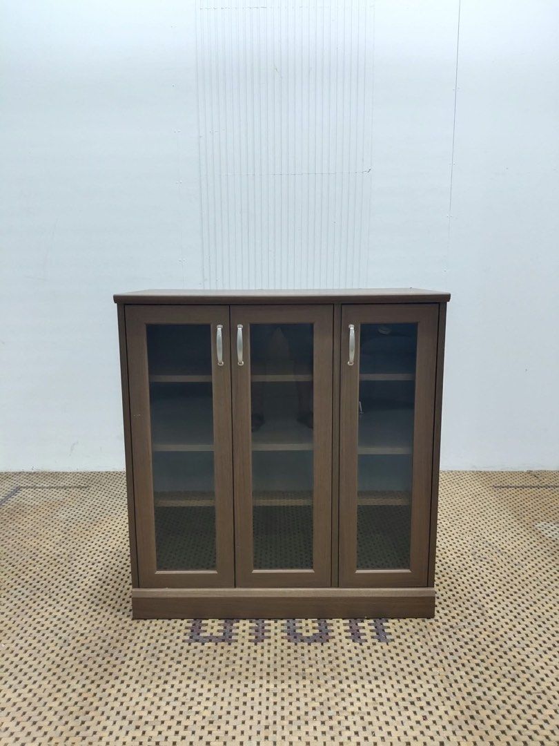 Display cabinet (Category: Shelves, Cabinets & Racks) located in Quezon City. Submitted by matetdevis13 (Listing ID 1465955860, Image 1). Description: Wooden 3-Door Glass Display Cabinet with Shelves Price: 5,500 L34 x W16 x H36 In good condition Code MJS17-RP19.