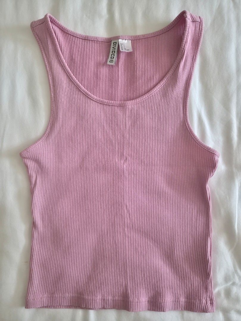 Divided H&M Basic Pink Ribbed Tank Top (Category: Sleeveless) located in Quezon City. Submitted by corrnic (Listing ID 1466027195, Image 2). Description: - Brand: Divided H&M Basic - Color: Pink - Size: S (fits true to size, great stretch) - Style: Sleeveless, scoop neckline, form-fitting, hip length - Condition: Clean, no flaws found - Perfect everyday basic top, easy to style with shorts or jeans.