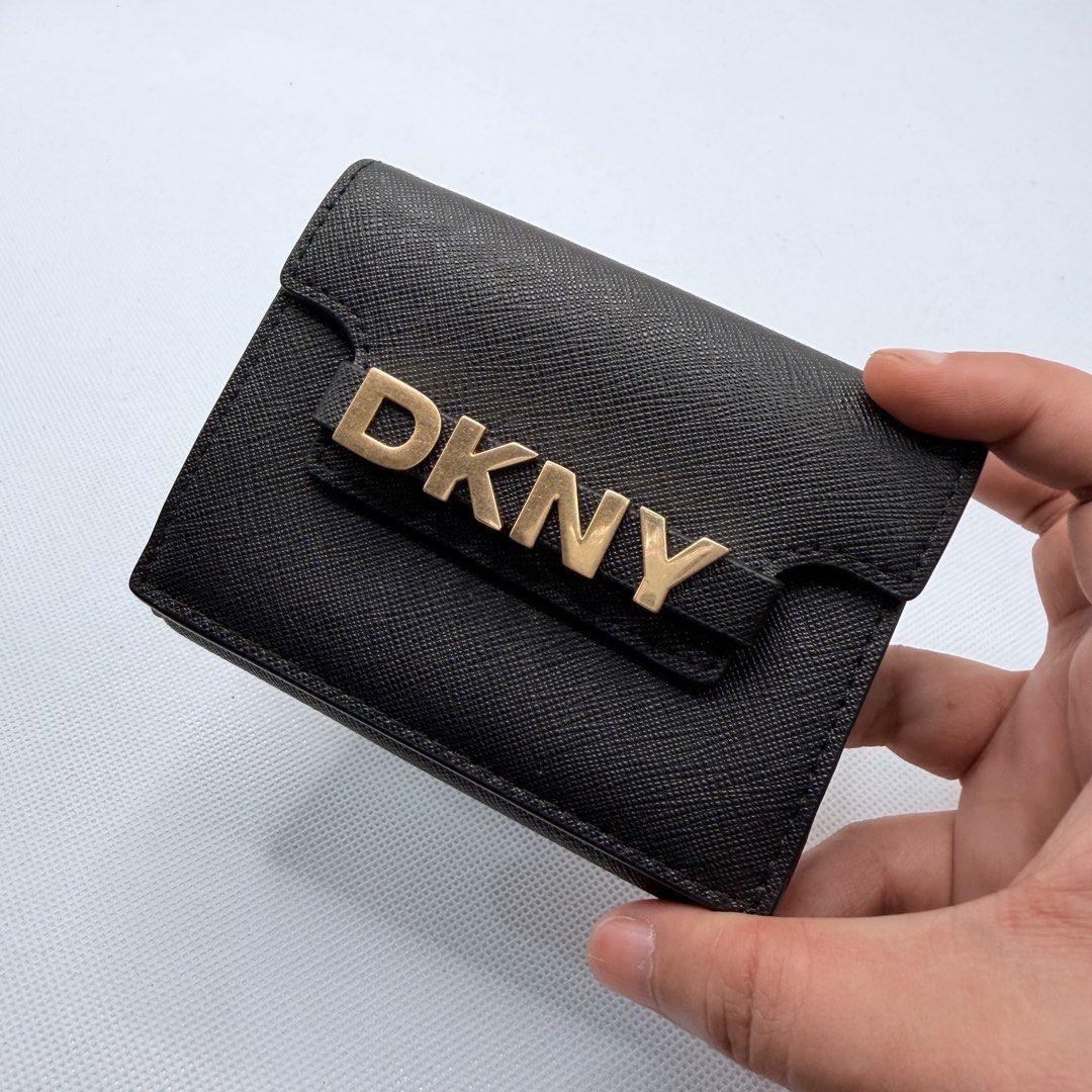 Dkny Orig Tri-fold Wallet (Category: Wallets & Card holders) located in Quezon City. Submitted by ajandstevenshopscorner (Listing ID 1466039909, Image 1). Description: May minor flaws lang not noticeable.