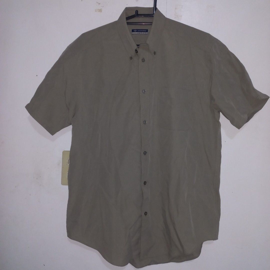 Grey Mens Medium Dockers Short Sleeve Polo (Category: Tshirts & Polo Shirts ) located in Mangaldan. Submitted by breadwinners (Listing ID 1466096309, Image 1). Description: - Brand: Dockers - Style: Short-sleeve button-down shirt with buttoned collar and single chest pocket - Color: Grey - Fit: Standard fit - Material: 52% rayon, 48% polyester (Made in Indonesia) - Condition: Excellent, versatile everyday wear.