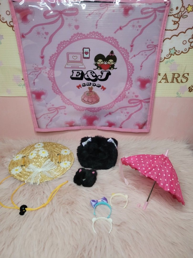 Doll accessories set, straw hat, pink umbrella, headbands (Category: Kids Toys) located in Paombong. Submitted by eandj.shop (Listing ID 1466040649, Image 2). Description: 🎀 Adorable mini accessory bundle for collectible plush toys and dolls 🎀 Includes daisy straw hat with a yellow chin strap 🎀 Fluffy black plush bag/hat piece and small black plush accessory 🎀 Charming pink polka dot miniature umbrella 🎀 Set of three tiny headbands in assort