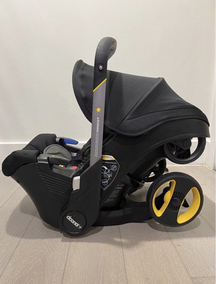 Doona+ Infant Car Seat and Stroller with Base (Category: Strollers) located in Makati City. Submitted by meddr_ (Listing ID 1466028238, Image 3). Description: - Authentic Doona+ infant car seat and stroller combo in black with grey inserts and yellow wheel accents - Instantly transforms from car seat to stroller in just seconds - No need to carry a heavy car seat—ideal for parents on the go - Includes vehicle base and original silver dust bag - C