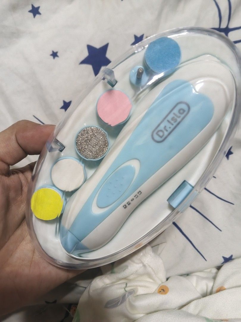 Dr. Isla Electric Baby Nail Trimmer Set (Category: Baby Toiletries & Grooming) located in Caloocan City. Submitted by dmrosxix (Listing ID 1466112549, Image 1). Description: - Authentic Dr. Isla electric baby nail trimmer in blue and white - Safe and gentle design prevents accidental nicks on infant nails - Comes with 6 interchangeable filing heads for different age stages - Adjustable speed settings for customized trimming - Battery-powered for 