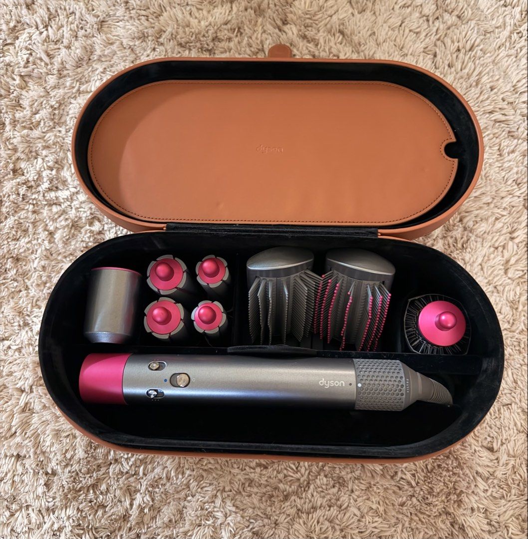 Dyson Airwrap Multi-Styler Complete Set (Category: Hair) located in Baliuag. Submitted by defnotmikaelaaaa (Listing ID 1465954441, Image 2). Description: Price: ₱14,000 (still nego!) Condition: Perfect condition — used less than 10 times Voltage: 220–240V Color: Nickel/Grey with Fuchsia accents Inclusions: * Dyson Airwrap main styling wand * 4 curling barrels * 3 brush attachments * Dryer/smoothing attachment * Filter cleaning brush * Original Dy