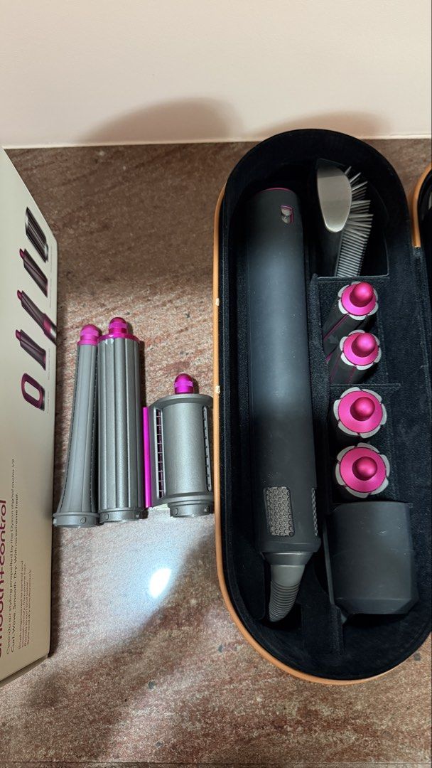 DYSON Airwrap smooth+control (WITH FREEBIES) (Category: Hair) located in Quezon City. Submitted by eavie.ong (Listing ID 1466084570, Image 2). Description: Dyson airwrap Comes with storage case and 30mm barrels, 40mm barrels, firm smoothing brush, and pre-styling dryer Freebies: 1) 20mm long barrel (original) 2) Anti flying wind nozzle (imitation) 3) 40mm long barrel (imitation).