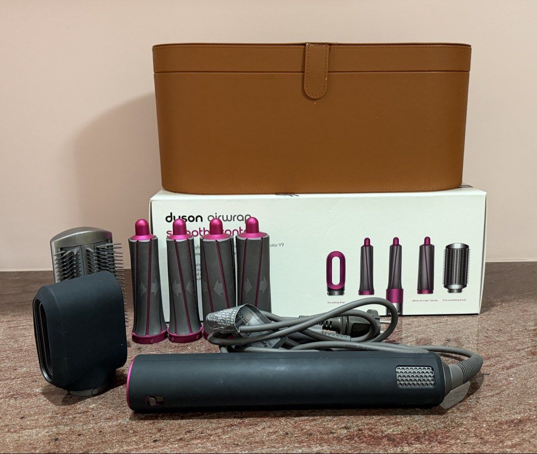DYSON Airwrap smooth+control (WITH FREEBIES) (Category: Hair) located in Quezon City. Submitted by eavie.ong (Listing ID 1466084570, Image 1). Description: Dyson airwrap Comes with storage case and 30mm barrels, 40mm barrels, firm smoothing brush, and pre-styling dryer Freebies: 1) 20mm long barrel (original) 2) Anti flying wind nozzle (imitation) 3) 40mm long barrel (imitation).