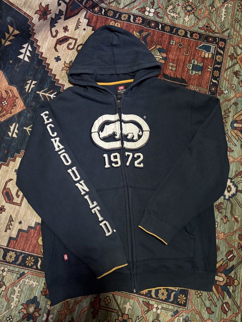Ecko Untld full-zip hoodie (Category: Coats, Jackets and Outerwear) located in Caloocan City. Submitted by worthysupplies-83215 (Listing ID 1466076200, Image 1). Description: vintage navy blue full-zip hoodie from Ecko Unltd. Good Condition (8/10) length: 29 inches width: 25 inches sleeve length: 25 inches ₱1,199 + shipping 📍North Caloocan.
