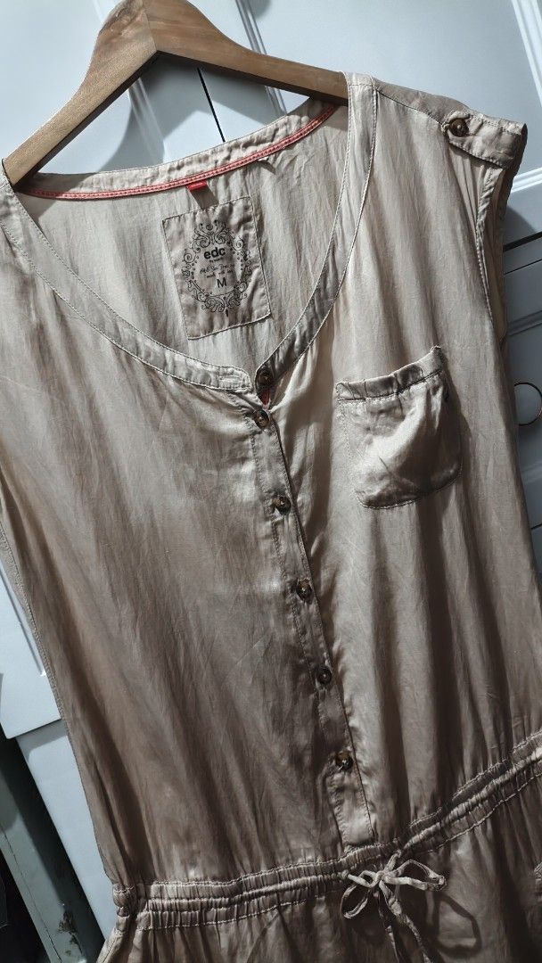 edc by Esprit Beige Jumpsuit Size M (Category: Jumpsuits) located in Manila. Submitted by zy0420 (Listing ID 1466055010, Image 2). Description: - Brand/Style: edc by Esprit utility dress - Size: M - Color: Classic beige - Design: Button-down front, V-neck, and chic shoulder button details - Fit: Adjustable drawstring waist for a flattering fit - Pockets: Convenient chest and side pockets - Fabric: Lightweight and breathable, ideal for warm weathe