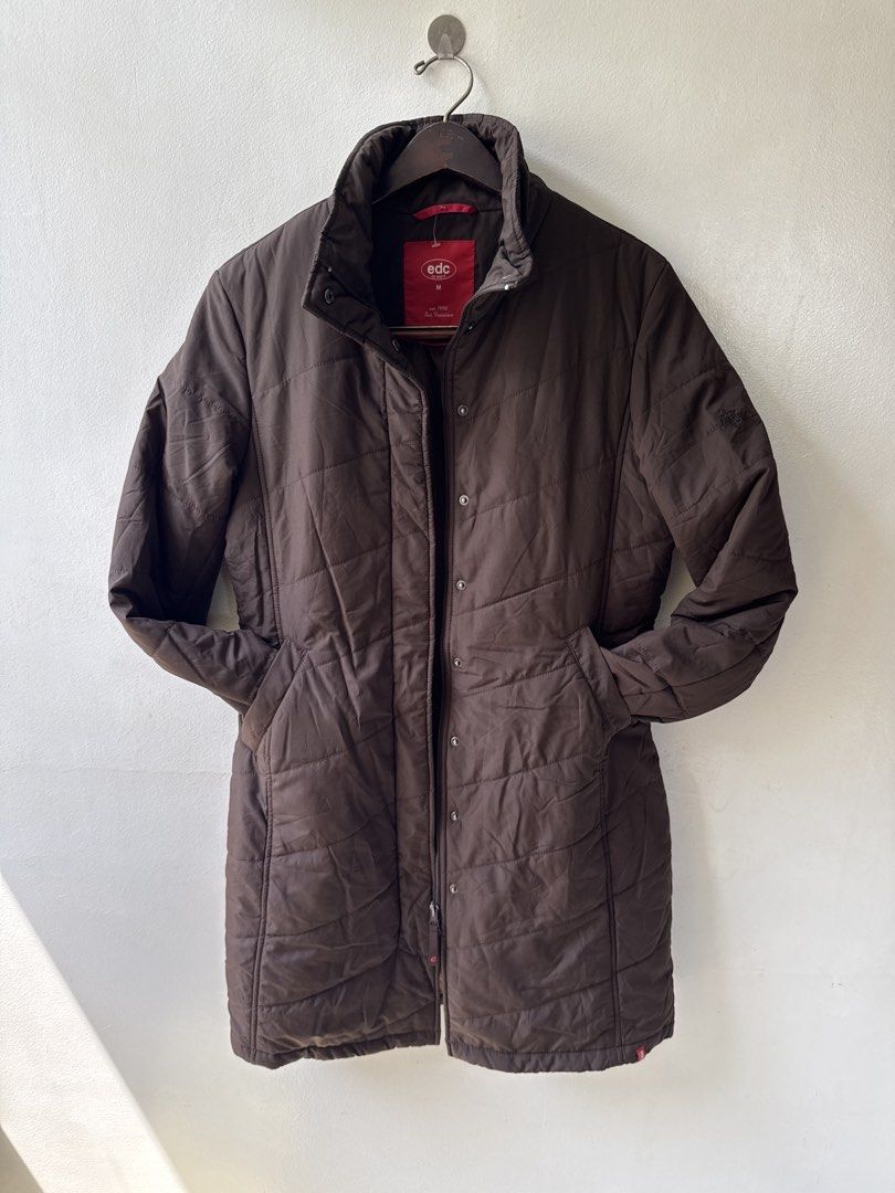 edc by Esprit Brown Quilted Puffer winter Jacket (Category: Coats, Jackets and Outerwear) located in Quezon City. Submitted by dropdeadprices (Listing ID 1465993935, Image 3). Description: - Brand/Model: edc by Esprit - Size: Medium - Color: Brown - Material/Style: Quilted puffer jacket - Closure: Zip front with snap button storm flap - Features: High collar, two side pockets, subtle embroidered logo on left sleeve - Fit: Regular length, ideal fo