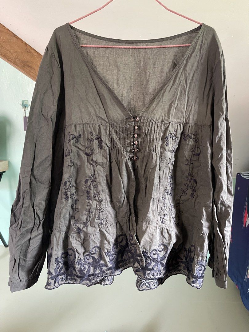 embroidered long sleeve V-neck blouse (Category: Longsleeves) located in Baybay. Submitted by shikita27906 (Listing ID 1466036508, Image 1). Description: - Color: Olive green - Style: Long sleeve blouse with deep V-neckline - Details: Dark floral embroidery, small button placket, and pleated details below the chest - Fit: Relaxed fit, lightweight material - Can fit M-L.