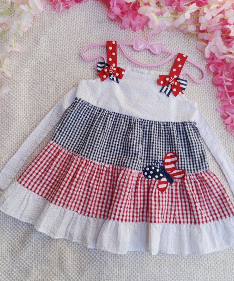 Emily Rose Butterfly Dress (Category: Babies & Kids Fashion) located in Sipocot. Submitted by mszari (Listing ID 1466001538, Image 1). Description: Emily Rose Patriotic Butterfly Tiered Dress (Size 18M) Price: ₱480 (Open for OFFER) Description: 🦋 Classic Preppy Gingham Dress 🦋 • Brand: Emily Rose • Size: Infant 18 Months • Color: Navy Blue, Red, and White • Design: Multi-pattern look featuring polka-dot shoulder bows, a seersucker bodice, stack