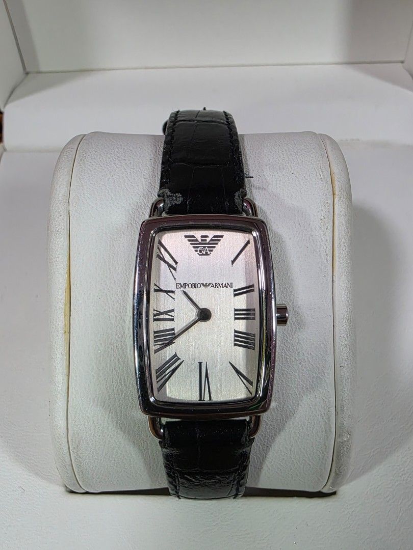 Emporio Armani AR-2107 Rectangular Watch (Category: Men's Watches) located in Rosales. Submitted by akumie30 (Listing ID 1466110679, Image 1). Description: Emporio Armani AR-2107 wrist watch. Rectangular silver dial, black leather strap. Roman numeral markers, Emporio Armani logo on the face. Solid stainless steel case back, 50 meters water resistant. Crown stamped with the Armani logo. Standard buckle closure. Original Armani Watch Working Condi