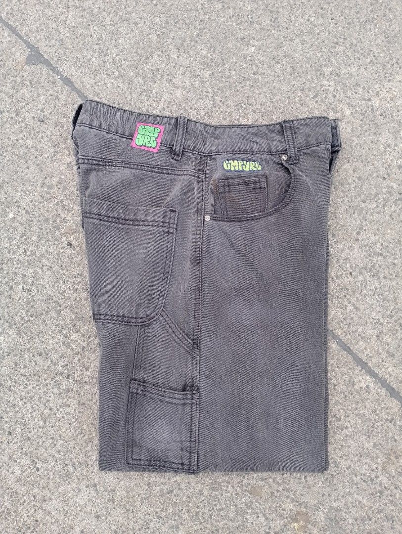 Empyre Dark Grey Washed Carpenter Pants (Category: Jeans) located in San Ildefonso. Submitted by lanz_baesa (Listing ID 1466069022, Image 1). Description: - Brand: Empyre - Style: Carpenter pants with relaxed baggy fit - Color/Wash: Washed dark grey with heavily faded style - Size: 5 - Features: Utility pockets, hammer loop, and neon green/pink woven branding patches on front and back waistband - Material: Sturdy denim.