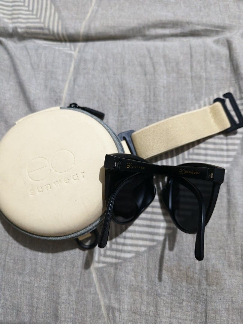 EO Sunwear Polarized Sunglasses with Hard Case (Category: Sunglasses & Eyewear) located in Manila. Submitted by rafaellyns62118 (Listing ID 1466096808, Image 2). Description: For sale E.O foldable polarized sunglasses - Brand: EO Sunwear / brandnew - Frame: Classic black with foldable temple arms - Lenses: Dark tinted polarized lenses for glare reduction - Inclusion: Cream-colored round hard case with zipper and strap - Packaging: Includes origin