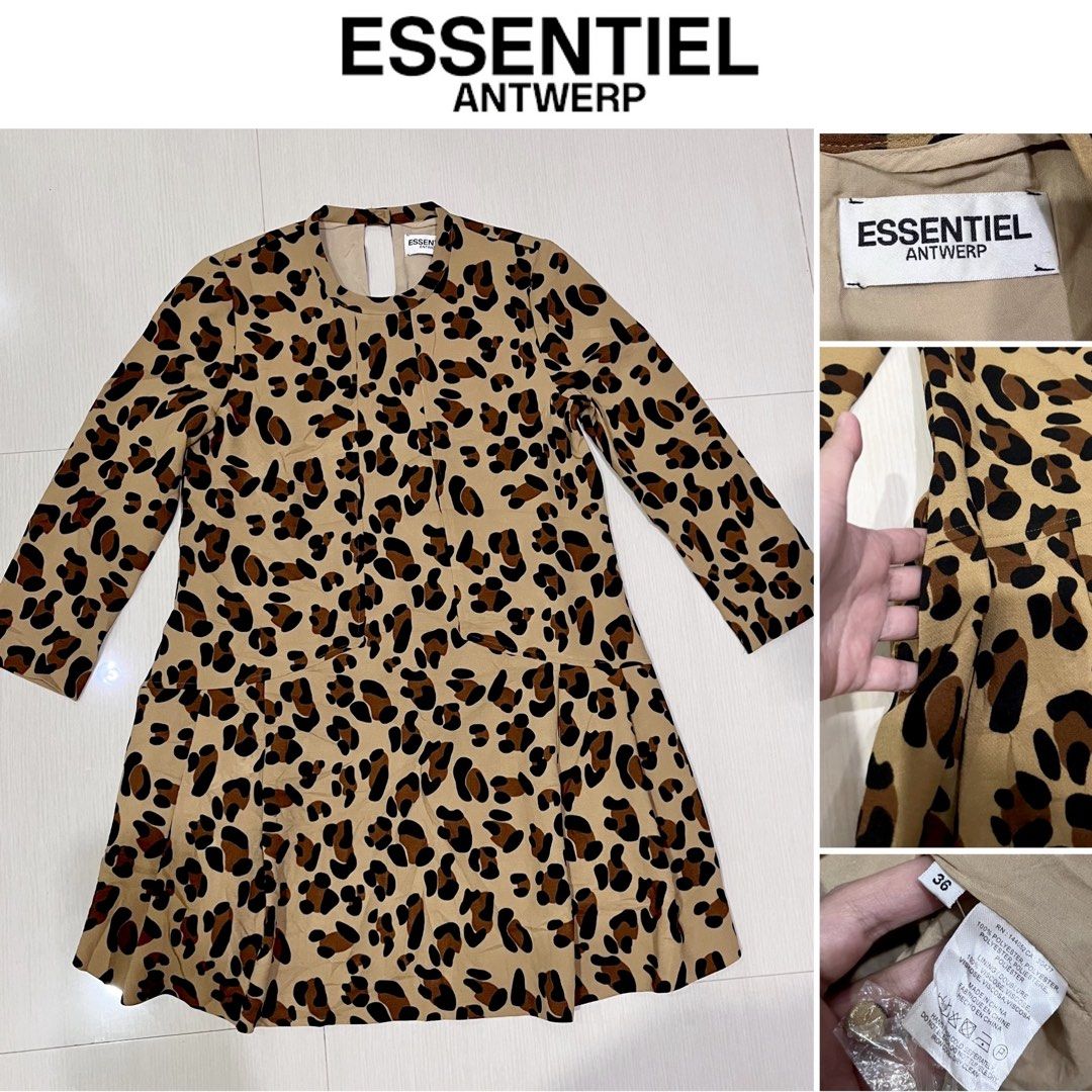 Essentiel Antwerp Leopard Print Mini Dress (Category: Dresses) located in Amlan (Ayuquitan). Submitted by pringpring (Listing ID 1466125552, Image 2). Description: - Brand: Essentiel Antwerp - Style: Mini dress with drop-waist pleated skirt - Print: Brown leopard - Size: 36 (fits S) - Features: Long sleeves, round neckline, and convenient side pockets - Closure: Back keyhole with button - Material: 100% polyester outer with comfortable viscose li