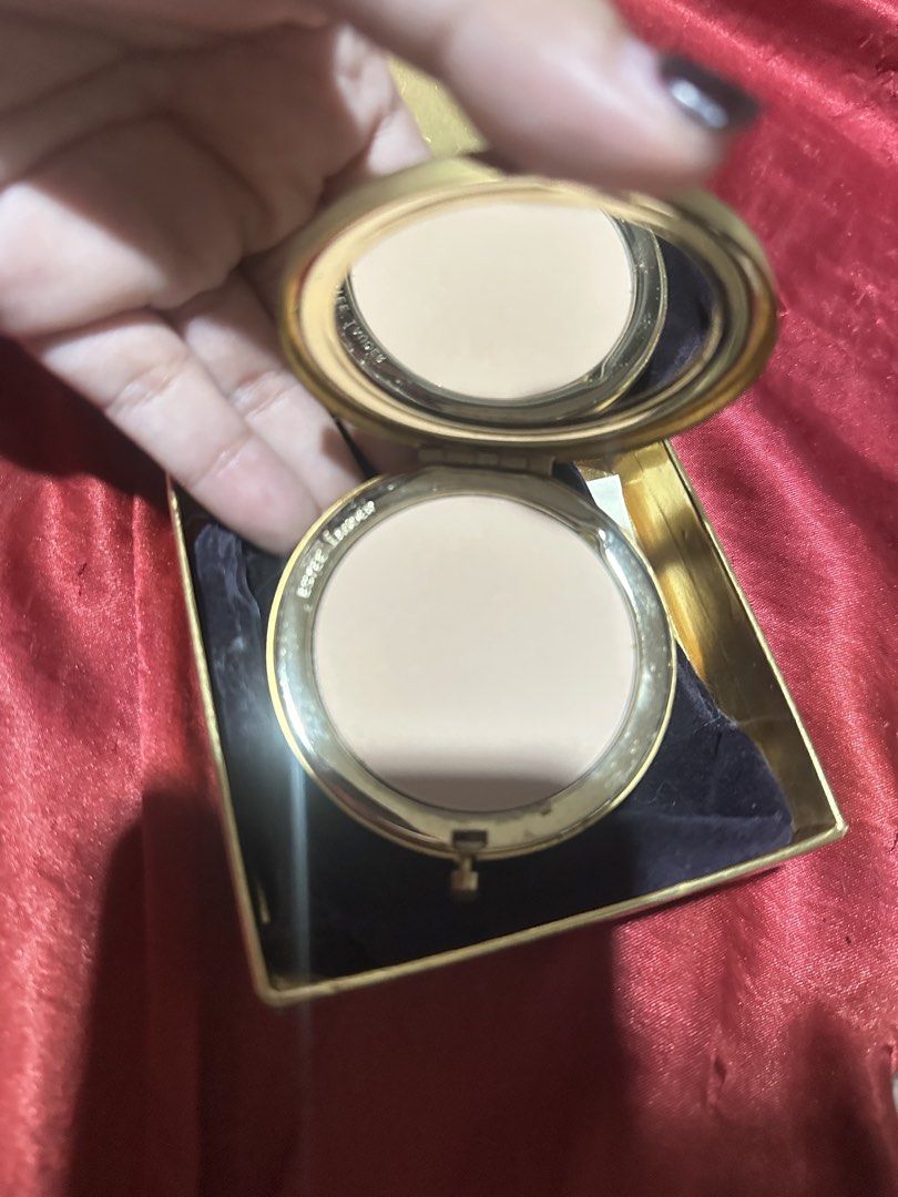 Estée Lauder compact mirror and lipstick set (Category: Makeup) located in Quezon City. Submitted by vespera13 (Listing ID 1466032568, Image 2). Description: bundle - Authentic vintage Estée Lauder collectible set - Golden compact mirror featuring elegant star and moon decorations - Matching textured gold lipstick tube containing red lipstick - Includes original gold presentation box and protective pouch - Perfect for vanity display, gifting, or 