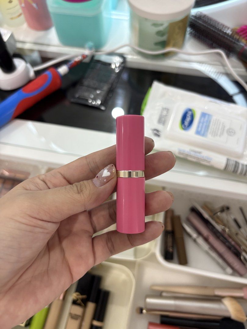 Estee Lauder lipstick (Category: Makeup) located in Manila. Submitted by monstershaaa (Listing ID 1466125579, Image 1). Description: - Vibrant bright pink lipstick tube with an elegant gold metallic ring - Smooth and durable plastic casing - Standard-sized container that fits easily in any makeup bag or purse - Perfect for hassle-free daily touch-ups anywhere you go.