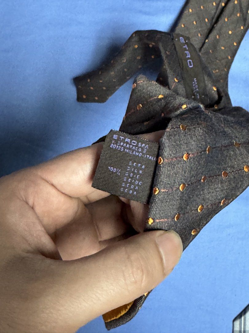 Etro Milan Italy 100% Silk Dot Pattern Tie (Category: Ties) located in Manila. Submitted by seangoart (Listing ID 1466050561, Image 3). Description: - Brand: Etro (Made in Milan, Italy) - Material: 100% Silk (lightweight and premium quality) - Design: Dark base with small orange dots and classic diagonal stripes - Dimensions: Standard width blade for a clean knot profile - Best for: Formal events, weddings, and business meetings - Condition: Exce