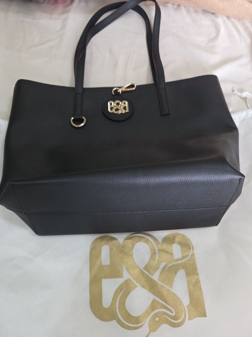 Eve & Adam Black Shoulder Bag (Category: Tote Bags) located in Quezon City. Submitted by jaye.elle (Listing ID 1465966919, Image 2). Description: Barely used black shoulder bag perfect for school or work. Comes with store provided bag and hang tag. No scratches or stuffs to mention, insides also clean. RFS: Decluttering MOP: Maya/Gcash Shipping at buyer's expense.