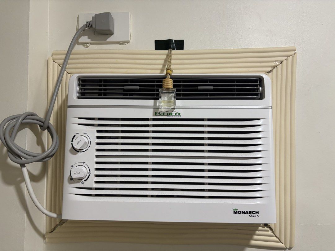 Everest Monarch Series Window Air Conditioner (Category: Air Conditioning and Heating) located in Manila. Submitted by alfredmari49701 (Listing ID 1466064576, Image 1). Description: - Brand/Model: Everest Monarch Series Window Type Air Conditioner - Color: Clean White with Grey Horizontal Louvers - Controls: User-friendly dual rotary dials for temperature and mode - Inclusion: Bonus hanging air freshener bottle attached above the unit - Condition
