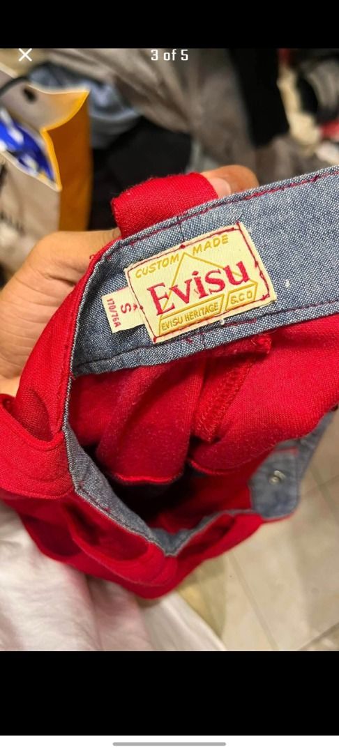 Evisu Red and Black Graphic Pants (Category: Jeans) located in Caloocan City. Submitted by silverbird_6c038f (Listing ID 1466042996, Image 3). Description: - Brand: Evisu (Custom Made Heritage Line) - Color: Bold red with striking black leg branding - Size: S (170/76A) - Details: Branded metal button & interior chambray waistband - Condition: Bright colorway, clean construction, ready to wear - Style: Unique streetwear statement piece.