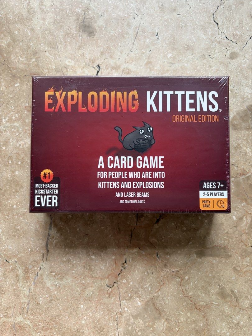 Exploding Kittens Card Game: Original Edition (Category: Board Games & Puzzles) located in Quezon City. Submitted by tidyup.lara (Listing ID 1466154908, Image 1). Description: Sold as is Condition 9/10: brand new and sealed in its original shrink wrap.