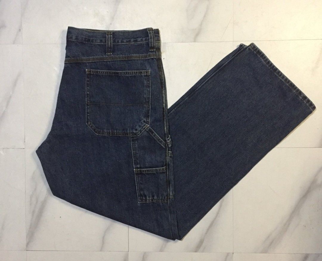 Faded Glory Carpenter Jeans 38x34 Dark Wash (Category: Jeans) located in Imus. Submitted by thrifts_select (Listing ID 1465996275, Image 1). Description: - Brand/Model: Faded Glory Carpenter Jeans - Size: 38x34 - Color: Dark wash with consistent coloring - Material: 100% cotton - Features: Utility side pockets, hammer loop, standard button fly, belt loops - Fit: Straight leg cut - Condition: Clean material throughout.