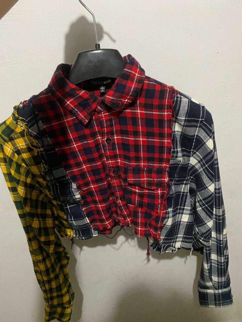 Fashion Nova Multi-Pattern Colorblock Flannel Crop Top (Category: Sleeveless) located in Manila. Submitted by ilovesoobin_13 (Listing ID 1466083641, Image 3). Description: - Brand: Fashion Nova - Style: Patchwork flannel crop top with raw hem - Size: Medium - Details: Long sleeves, button-down front, and dual chest pockets - Design: Mismatched red, yellow, and black-and-white plaid with a large "OFF LINE" back graphic.