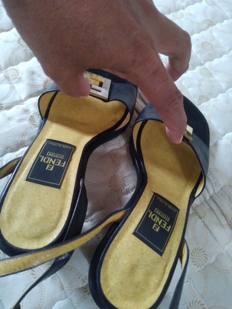 Fendi Block-Heel Sandals FF Front Logo (Category: Heels) located in Zamboanga. Submitted by zhumhazhav (Listing ID 1466038493, Image 3). Description: These Fendi Sandals Black leather and patent/satin Black heel Sandals. Featuring a 2 tone gold & silver metallic color way. Metal Fendi/FF logo plaque on the front strap, yellow/tan lining and red ankle/Black strap. Tag size 34.5 In good condition Minor sign of usage Check all photos for details 125