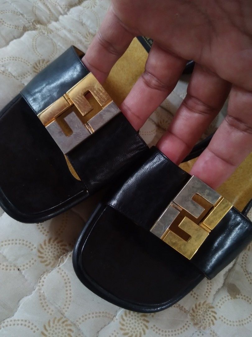 Fendi Block-Heel Sandals FF Front Logo (Category: Heels) located in Zamboanga. Submitted by zhumhazhav (Listing ID 1466038493, Image 2). Description: These Fendi Sandals Black leather and patent/satin Black heel Sandals. Featuring a 2 tone gold & silver metallic color way. Metal Fendi/FF logo plaque on the front strap, yellow/tan lining and red ankle/Black strap. Tag size 34.5 In good condition Minor sign of usage Check all photos for details 125