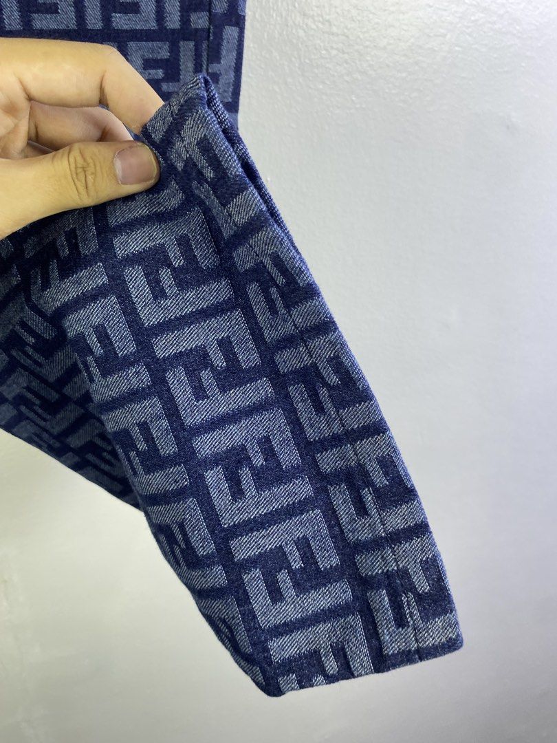 Fendi FF Monogram Denim Jeans (Category: Jeans) located in Manila. Submitted by declutterpromax (Listing ID 1466018285, Image 3). Description: - Brand: Fendi - Color: Blue denim - Pattern: Allover FF monogram - Fit: Straight leg - Details: Classic five-pocket styling, branded metal buttons and rivets, black leather Fendi Roma patch on the back waistband - Condition: Excellent, clean stitching and solid hardware.