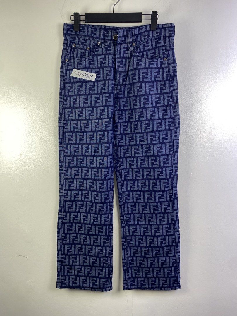 Fendi FF Monogram Denim Jeans (Category: Jeans) located in Manila. Submitted by declutterpromax (Listing ID 1466018285, Image 1). Description: - Brand: Fendi - Color: Blue denim - Pattern: Allover FF monogram - Fit: Straight leg - Details: Classic five-pocket styling, branded metal buttons and rivets, black leather Fendi Roma patch on the back waistband - Condition: Excellent, clean stitching and solid hardware.