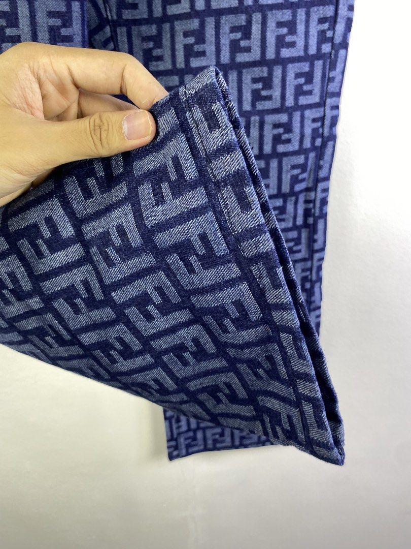 Fendi FF Monogram Denim Jeans (Category: Jeans) located in Manila. Submitted by declutterpromax (Listing ID 1466018285, Image 2). Description: - Brand: Fendi - Color: Blue denim - Pattern: Allover FF monogram - Fit: Straight leg - Details: Classic five-pocket styling, branded metal buttons and rivets, black leather Fendi Roma patch on the back waistband - Condition: Excellent, clean stitching and solid hardware.