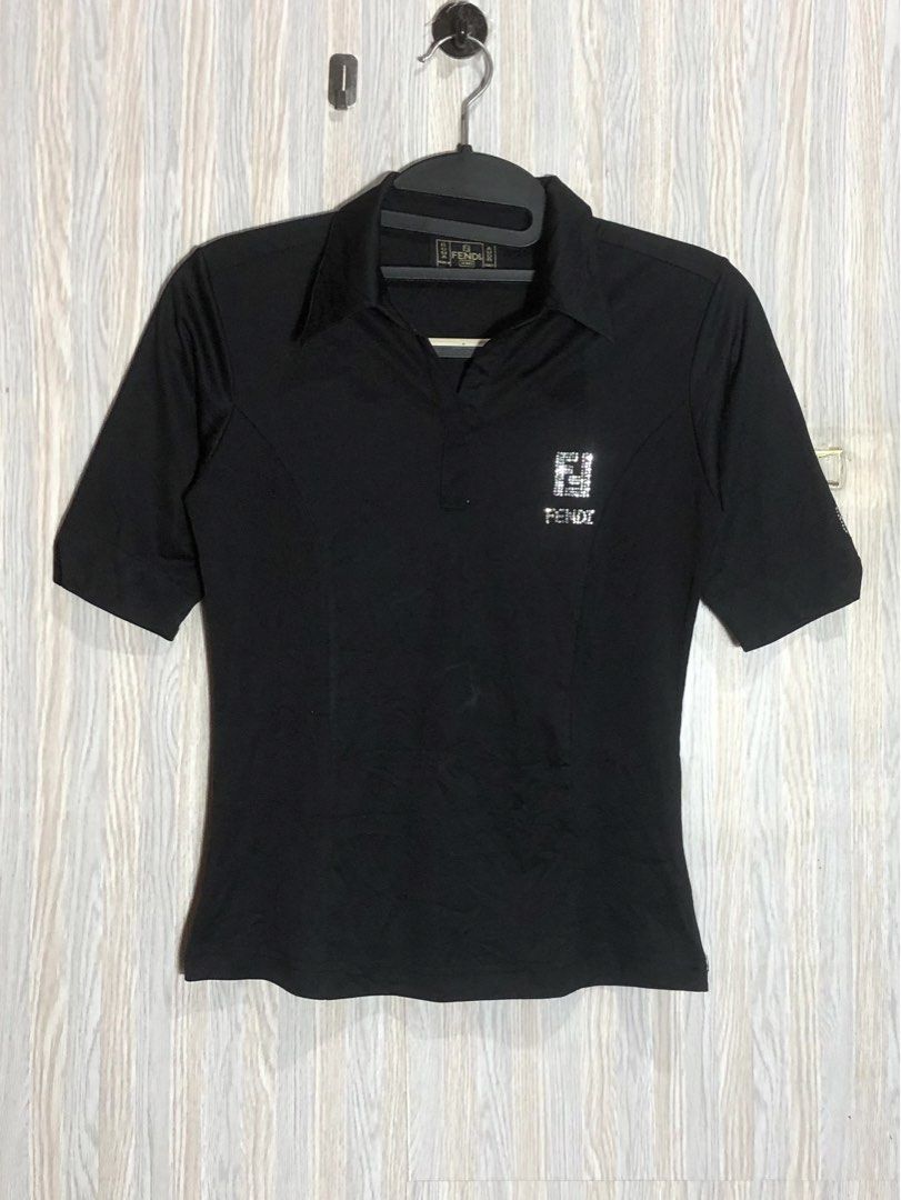 Fendi Jeans Black Polo Shirt Medium (Category: Blouses) located in Montevista. Submitted by rdthriftshub (Listing ID 1466060541, Image 1). Description: - Brand: Fendi Jeans - Color: Black - Size: Medium - Details: Eye-catching rhinestone Fendi logo on the chest, classic collar, short sleeves - Origin: Made in Italy - Condition: Great classic cut, versatile for casual or smart-casual outfits - Shipping: Fast ship-out from a trusted PH seller!.